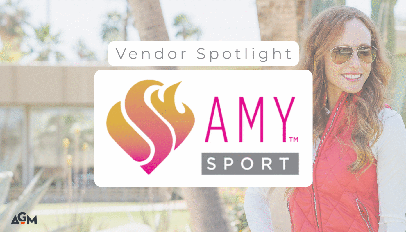 Graphic promoting a vendor spotlight on Amy Sport, featuring the brand’s heart-and-flame logo and name in bold pink and gray text, overlaid on a background of a smiling woman in a red quilted vest and white top standing outdoors near palm trees and desert plants. AGM logo appears in the bottom left corner.