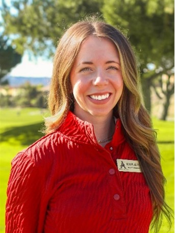 Kathryn Alter headshot. Young woman with long brown hair wearing a red quarter zip and club name tag smiling into the camera.