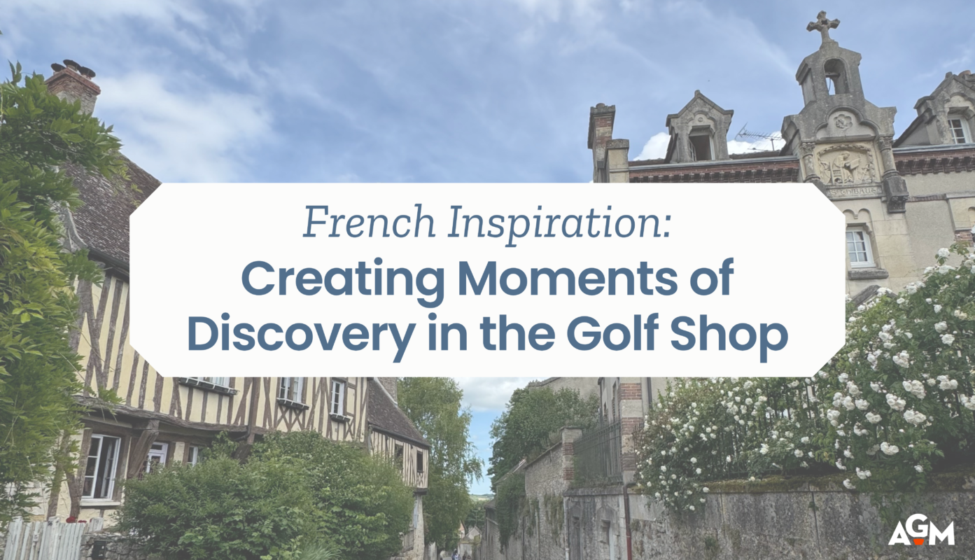 Graphic titled “French Inspiration: Creating Moments of Discovery in the Golf Shop” set against a scenic background of a quaint French village. The photo features half-timbered houses, a cobblestone street, and blooming white flowers, evoking a sense of charm and wanderlust. AGM logo in the bottom right corner.
