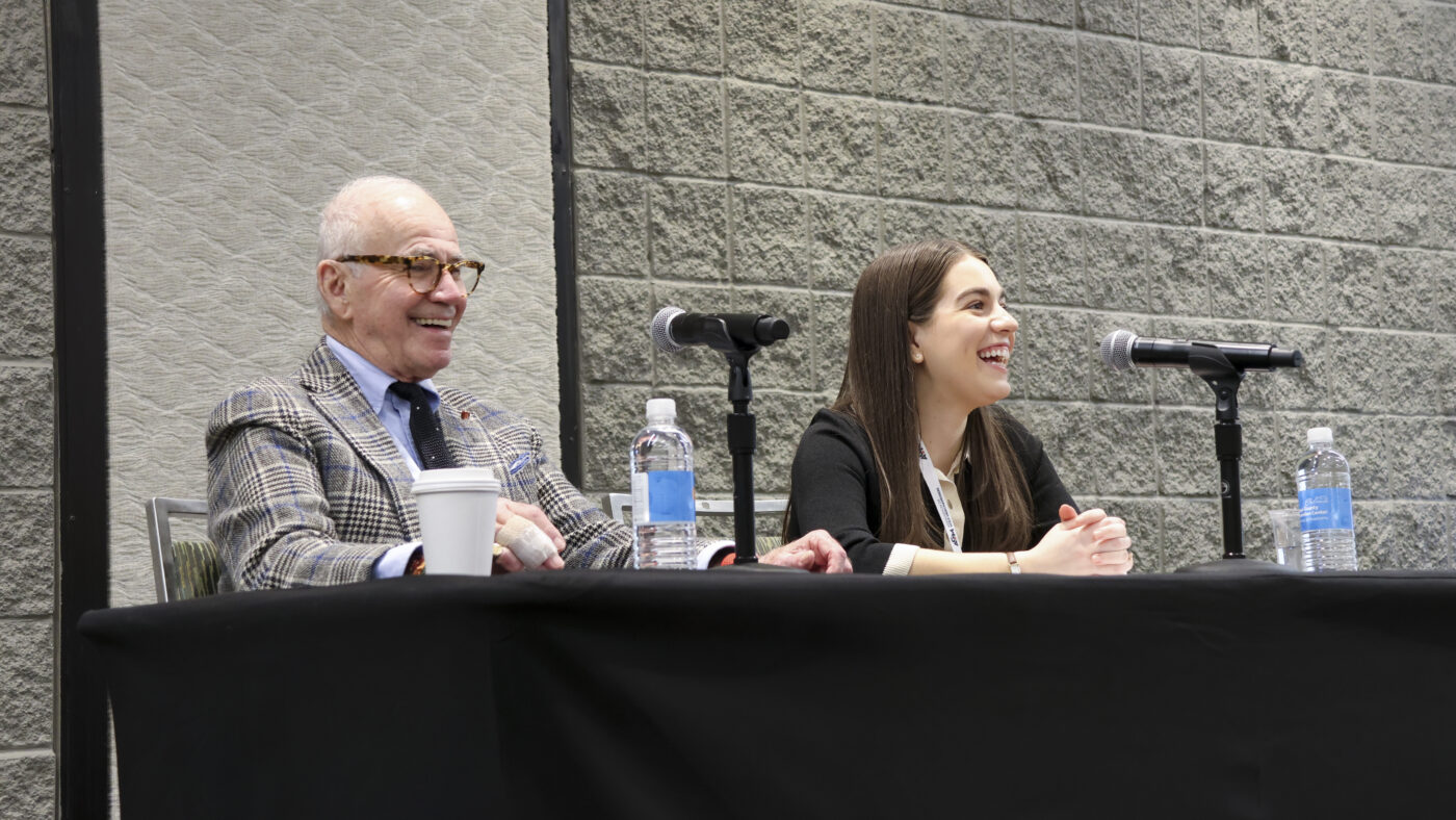 Marty Hackel and Justine Cook doing a live podcast recording at the 2025 AGM Retail Conference.