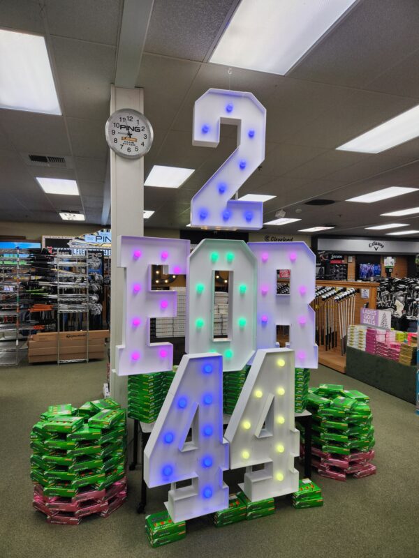 Haggin Oaks 2 for 44 Srixon ball display, featuring large letters and numbers with pastel colored lightbulbs.