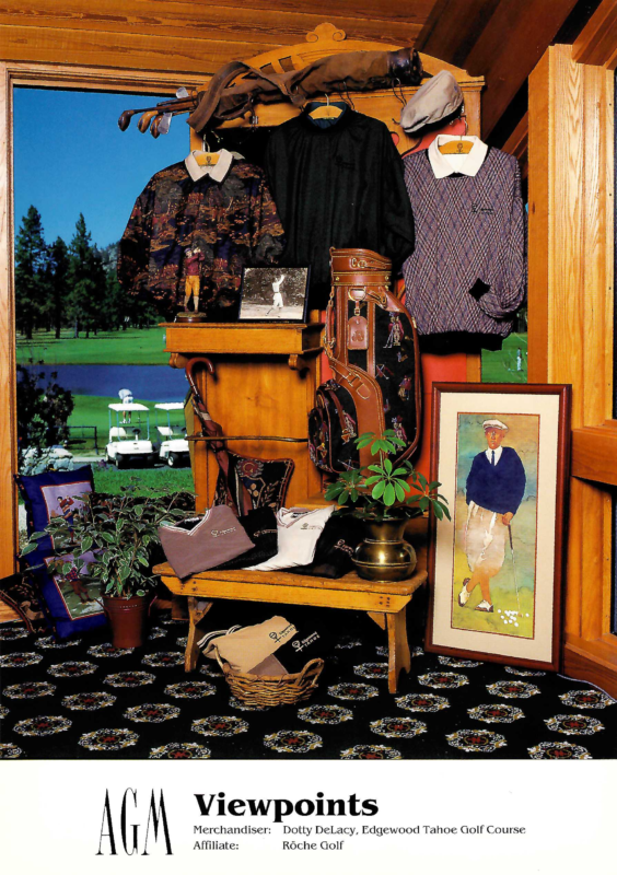 AGM Viewpoints merchandising display created by merchandiser Dotty DeLacy of Edgewood Tahoe Golf Course in partnership with Roche Golf. The display is arranged around a wooden hall tree and bench, featuring patterned golf apparel, sweaters, accessories, a vintage-style golf bag, framed golf artwork, plants, and golf memorabilia. A golf bag and clubs rest across the top of the fixture, while a scenic golf course is visible through the window behind the display. The bottom caption reads: “AGM Viewpoints. Merchandiser: Dotty DeLacy, Edgewood Tahoe Golf Course. Affiliate: Roche Golf.”