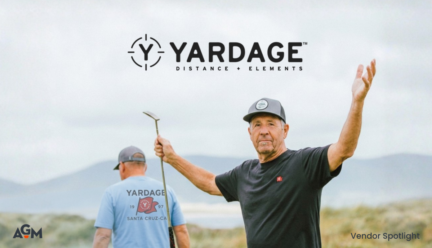 Featured graphic for an AGM Vendor Spotlight on Yardage. The Yardage logo and tagline “Distance + Elements” appear at the top over an outdoor golf setting. In the foreground, a man wearing a black Yardage shirt and cap holds a golf club with his arms extended, while another man faces away wearing a light blue Yardage shirt featuring a Santa Cruz, California graphic. The AGM logo appears in the lower-left corner, with “Vendor Spotlight” in the lower-right. The image highlights Yardage’s casual, golf-inspired apparel and brand identity.