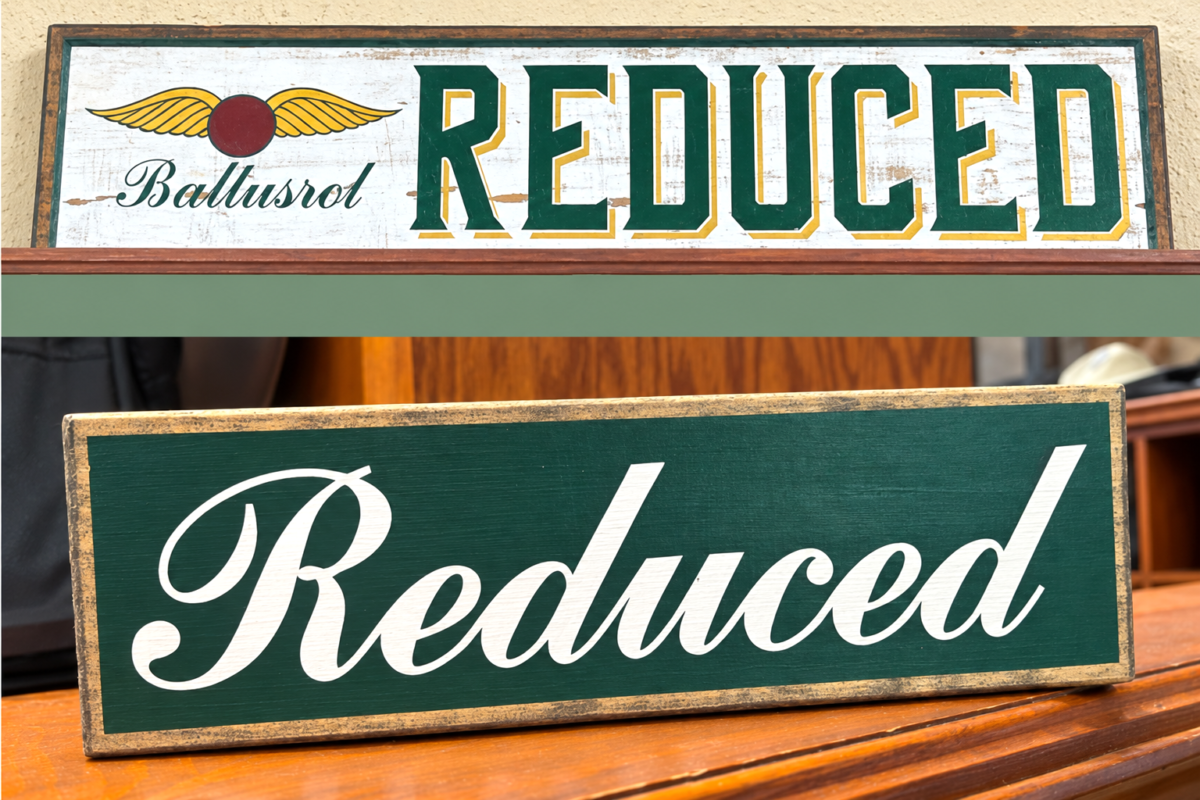 Side-by-side comparison photographs of vintage-style “Reduced” signs at Baltusrol Golf Club. The top sign features the Baltusrol logo and bold green lettering with gold accents, while the bottom sign displays “Reduced” in white cursive lettering against a dark green background with a distressed gold border.